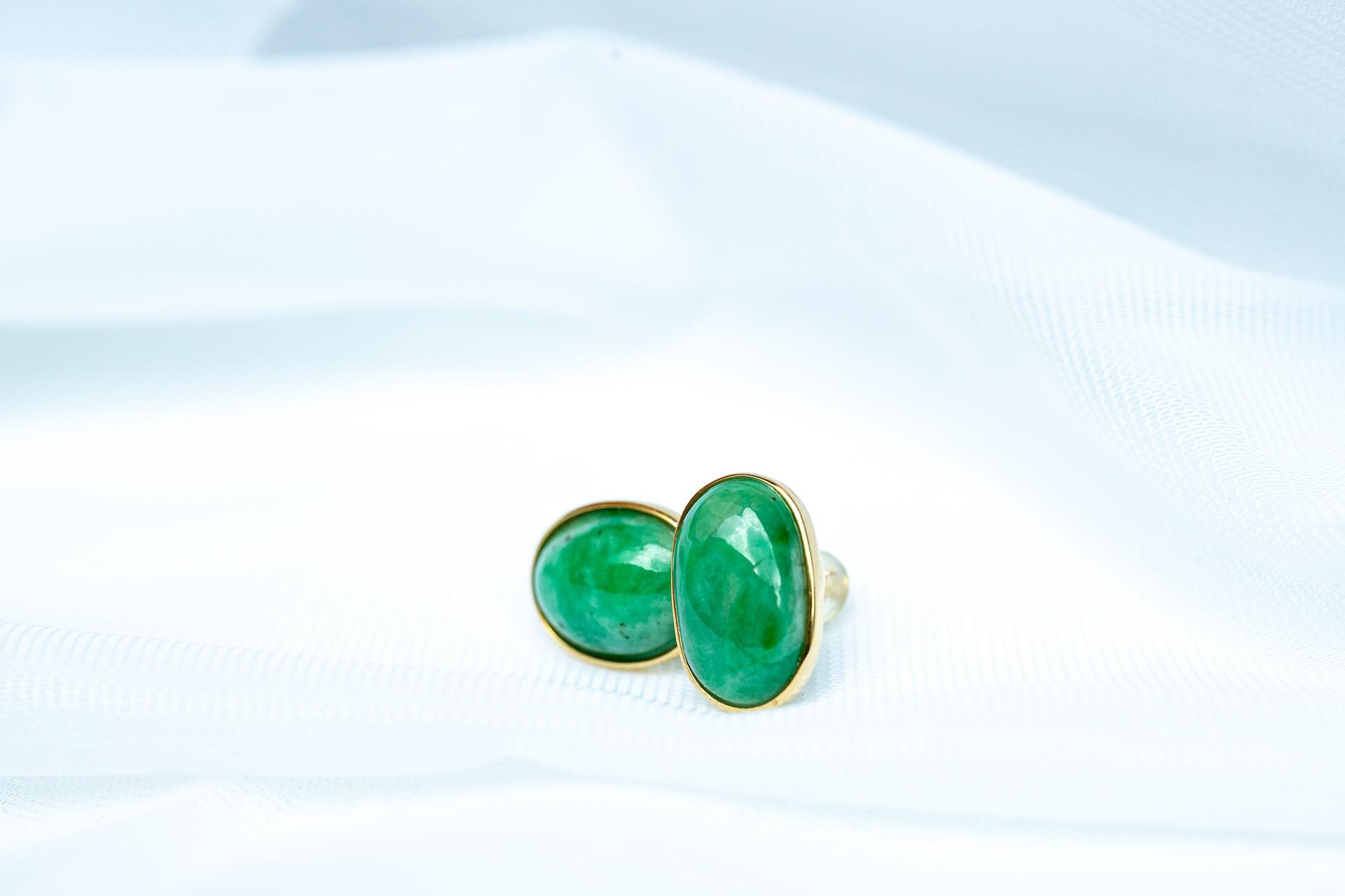 golden ear studs made of of Indian Jade